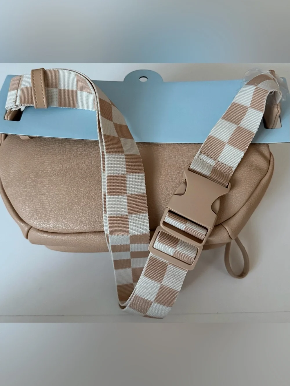Cloud Island diaper sling in tan with checkered strap